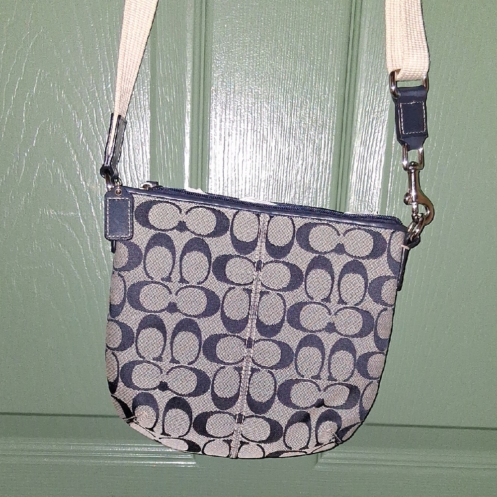 Coach Black and Cream Crossbody Bag with Signature Design